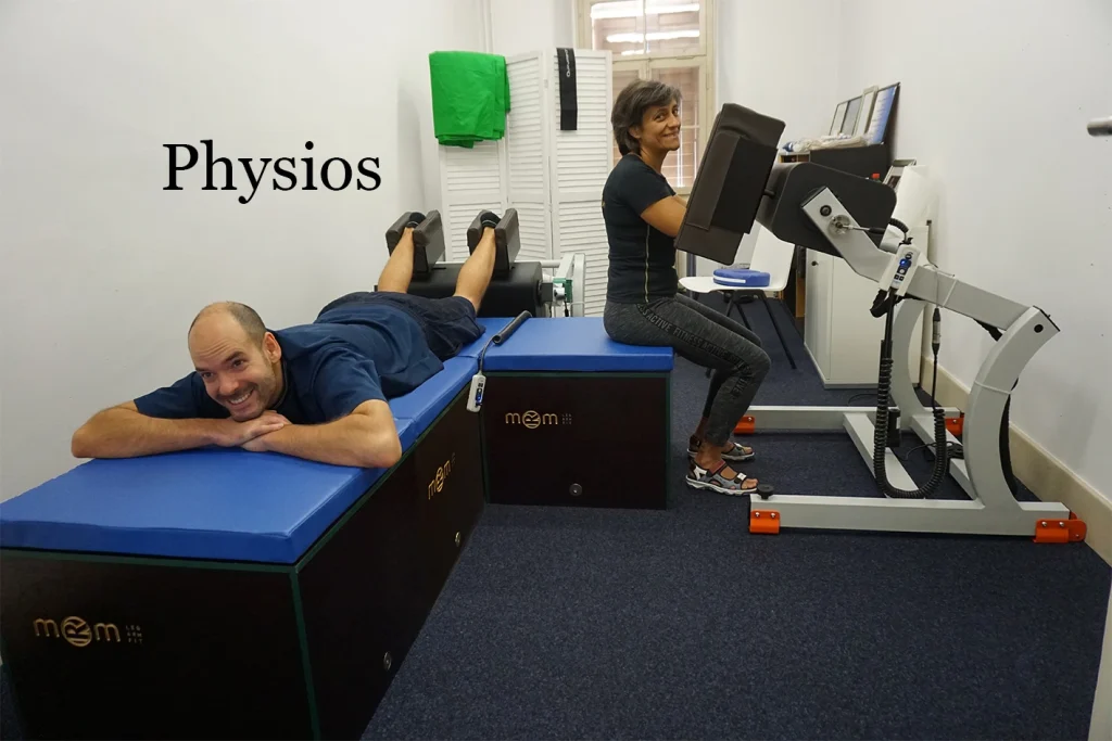 Physiotherapy center with the MRM Sport device applying deep massage to legs while a professional uses the equipment on arms.